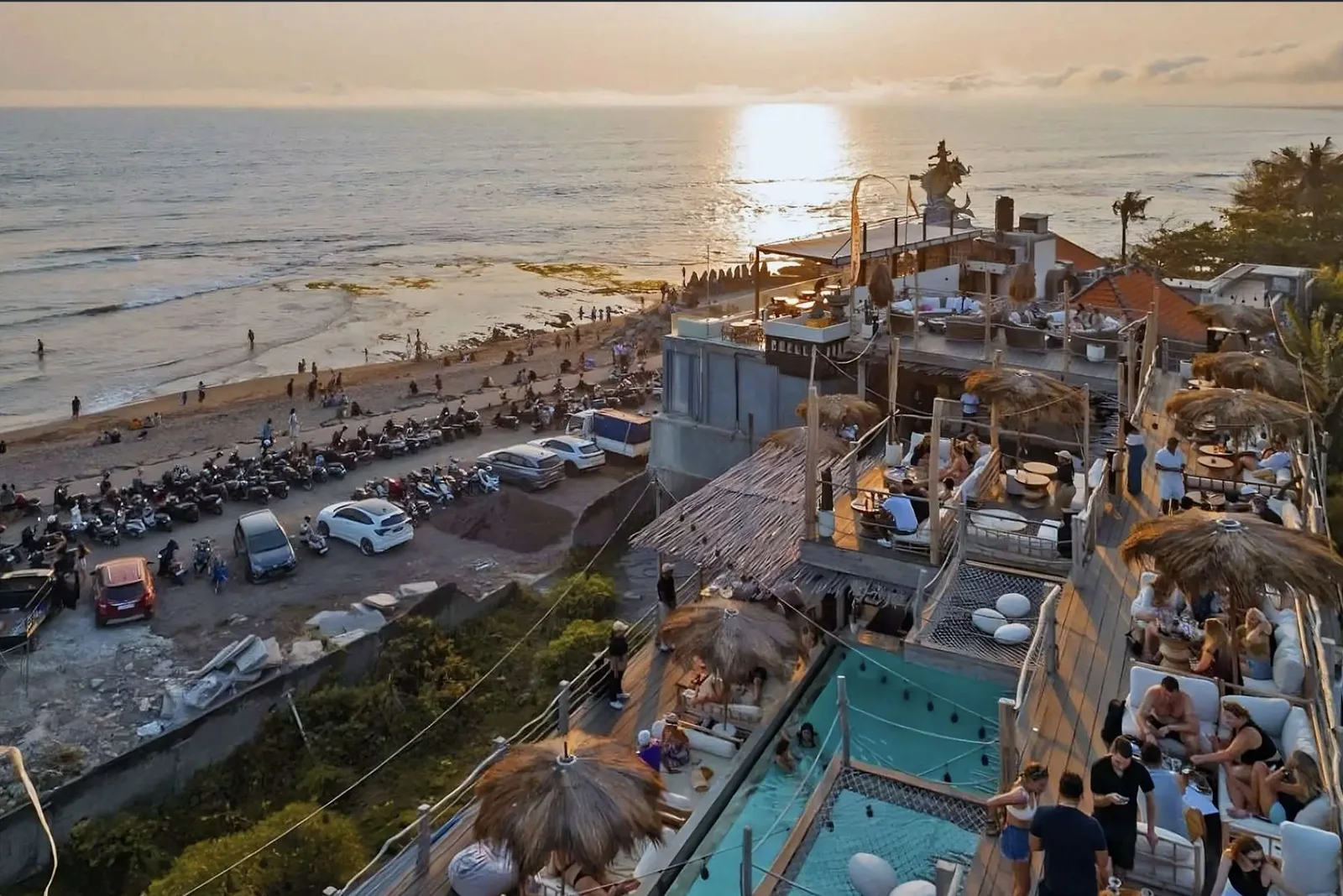 Sol Rooftop at sunset — decks, pool, and daybeds above the Canggu beachfront